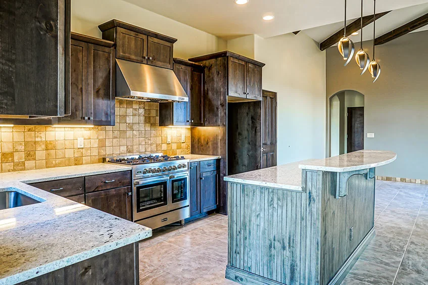 The Mesa kitchen with a shaped island and range alcove