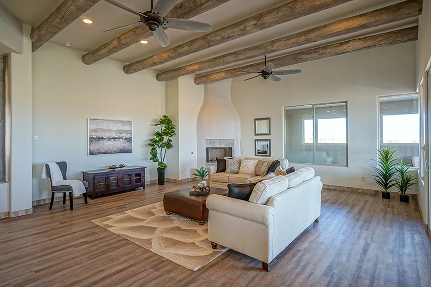 Great room with vigas and a kiva-style fireplace