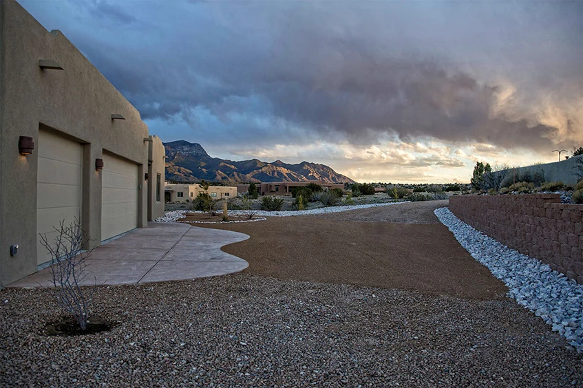 Finished Misty Grand home facing the New Mexico landscape at dusk